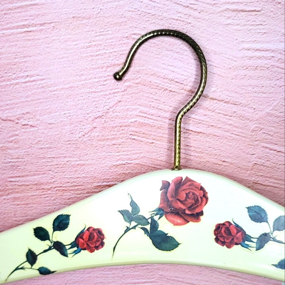 Vintage wooden clothes hanger with roses